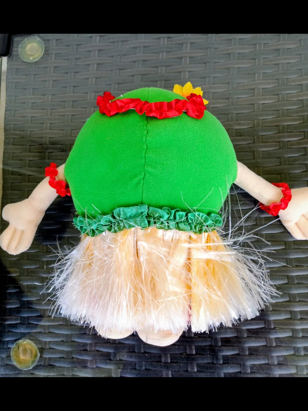 M&M'S Green Plush Hula Doll with Yellow Skirt and Red Flower Accents.Collectible